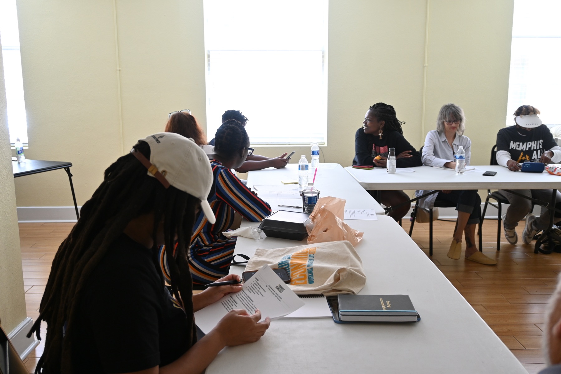 Participants reading and talking during a workshop
