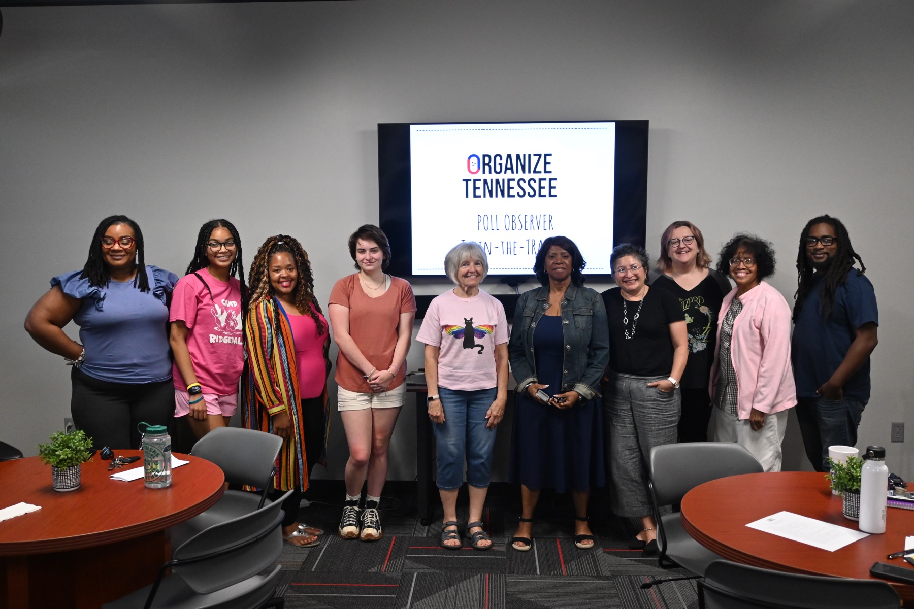 Poll observers standing in front of an Organize Tennessee training screen