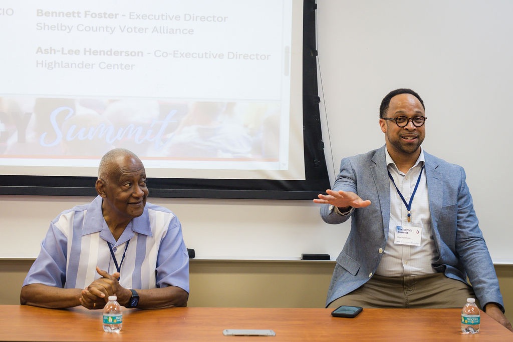 Two civic leaders sharing a summit panel